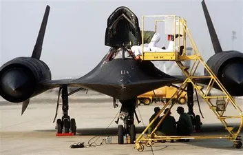 SR-71 Blackbird from front on tarmac with pilot ladder